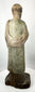 Hand-carved religious santo with worn paint and historic surface wear
