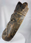 African ritual mask featuring carved third-eye symbol, open mouth, and traces of original pigment.
