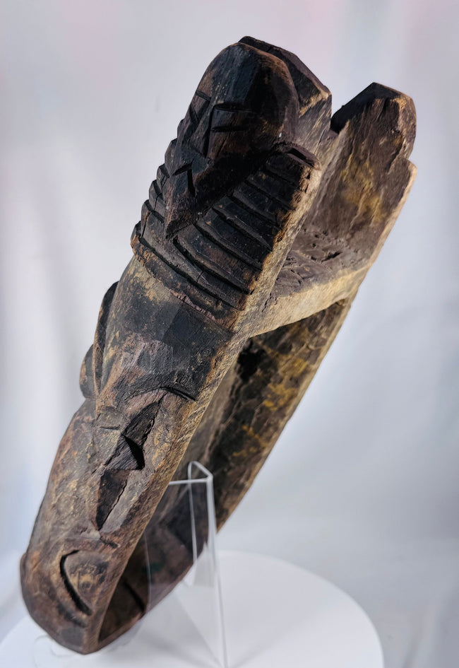 Large tribal mask from West Africa displaying dramatic ceremonial features and traditional craftsmanship.