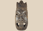 Antique West African ceremonial mask with carved third eye, open mouth, and expressive tribal features.