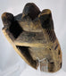 Historic African ceremonial mask with hand-carved details, weathered pigment, and spiritual symbolism.