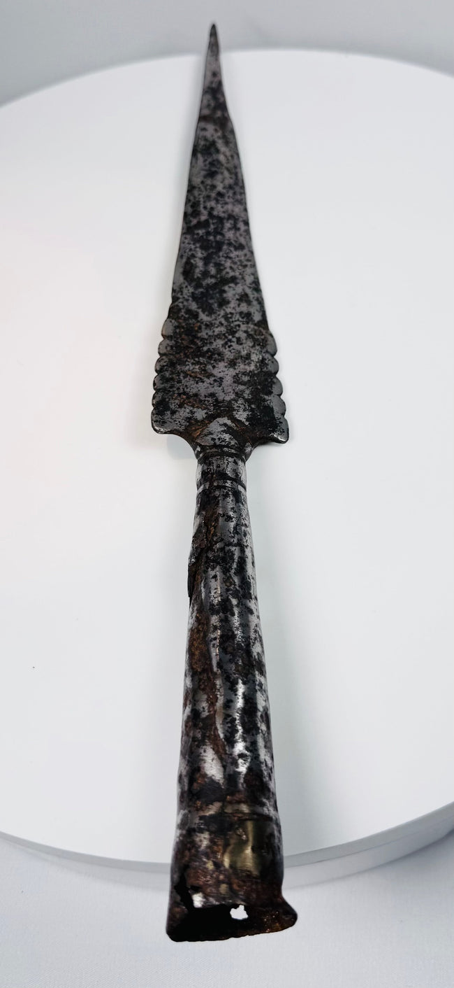 Early European iron weapon with pointed spear blade, deep surface patina and socketed shaft fitting