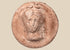 Hellenistic Greek terracotta female bust medallion with frontal portrait and aged pinkish-buff surface.