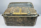 Angled exterior of an antique Southeast Asian betel nut box highlighting its rectangular form, brass borders, and engraved side panels.