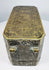 Top of a Philippine betel nut box displaying dense floral scrollwork and symmetrical brass-inlaid decoration across the lid.