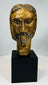 Carved wooden Christ head with expressive facial features