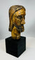 European devotional sculpture of Christ with aged paint remnants