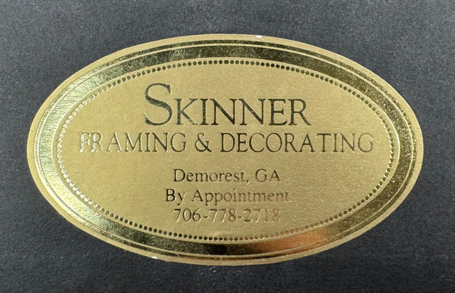 Skinner Framing and TruGuard conservation labels on the reverse of the framed manuscript