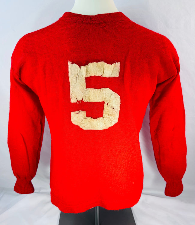 Reverse view of red Sages hockey sweater displaying applied number 5