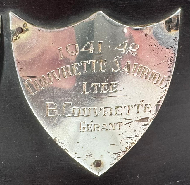 Engraved championship shield mounted to the Metropolitan Hockey League trophy base
