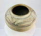 Profile view of a rounded Huastec-style terracotta water vessel