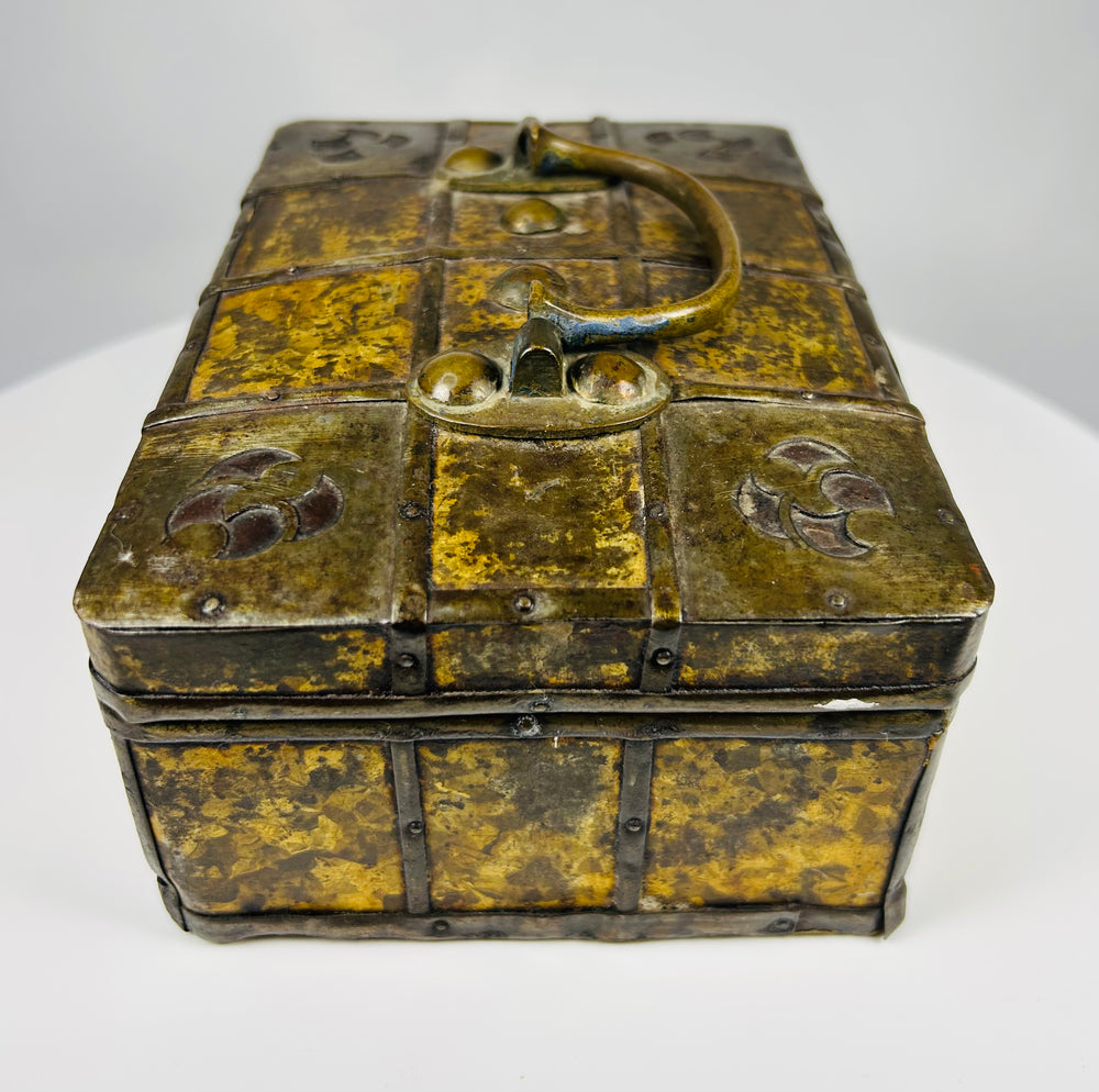 Antique Eastern European iron reinforced valuables chest with mottled gilt metal panels and working lock, circa 1800–1830.