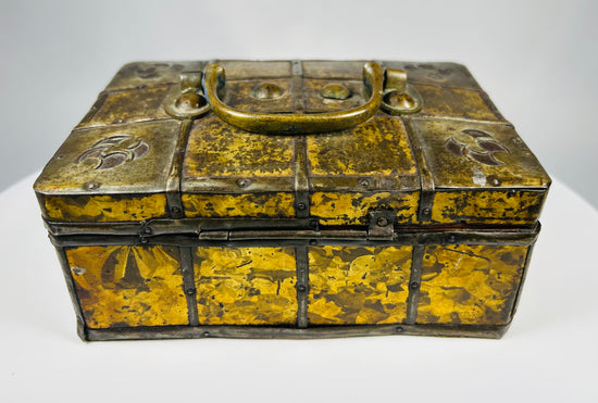 Small iron-bound wooden strongbox with decorative gilt metal frost pattern panels and original key, Eastern Europe, early 19th century.