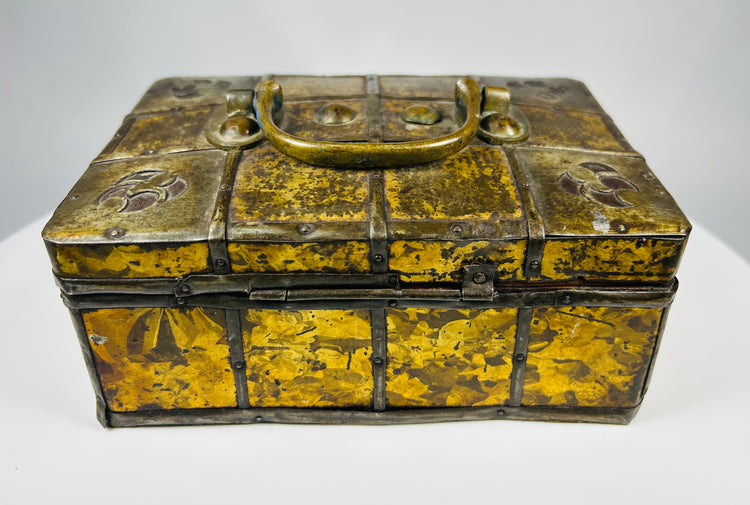 Small iron-bound wooden strongbox with decorative gilt metal frost pattern panels and original key, Eastern Europe, early 19th century.