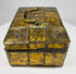 Early 1800s Eastern European jewelry casket with iron straps, riveted construction, and decorative gilt metal panel covering.