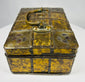 Early 1800s Eastern European jewelry casket with iron straps, riveted construction, and decorative gilt metal panel covering.