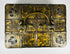 Antique iron-bound valuables chest with arched carrying handle, gilt patterned panels, and original working key.