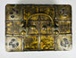 Antique iron-bound valuables chest with arched carrying handle, gilt patterned panels, and original working key.