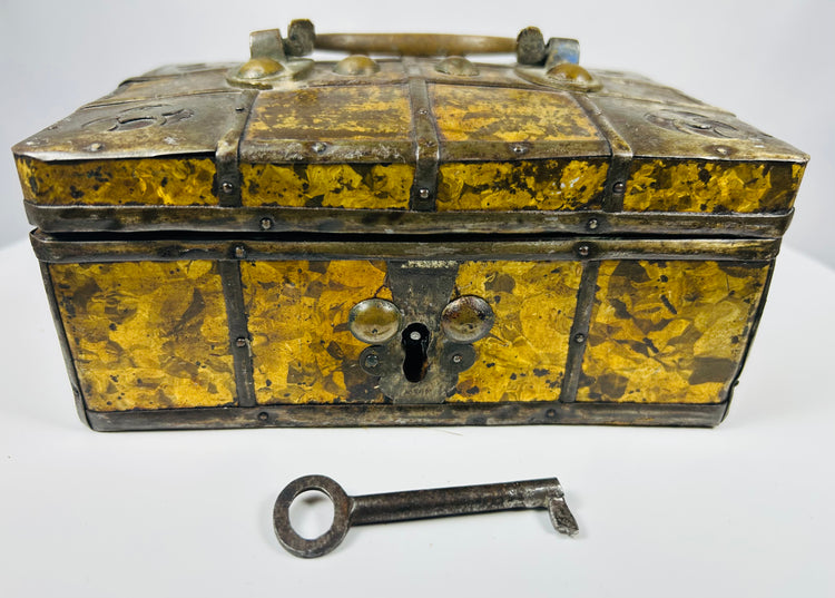 Historic Eastern European iron reinforced jewelry casket with textile lined interior and gilt metal decorative panels.