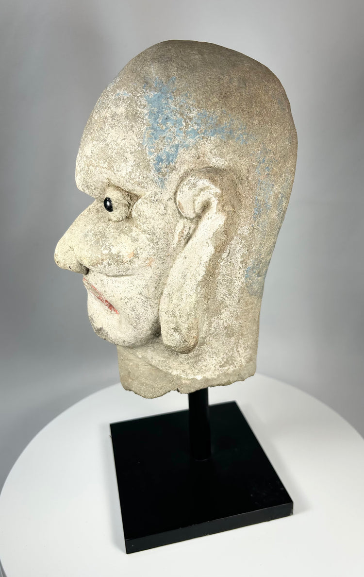 Hand-carved Chinese stone head depicting a Luohan disciple of Buddha, 18th–19th century.