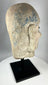 Qing Dynasty carved stone Luohan head with pronounced brows and expressive facial features.