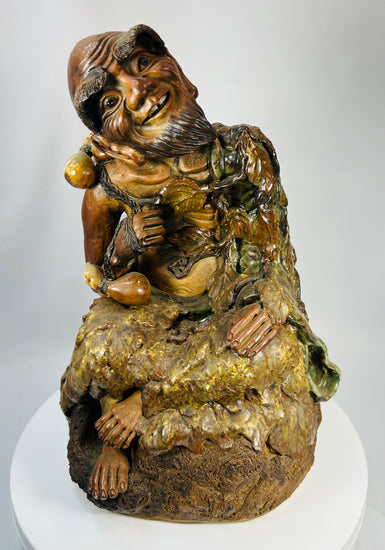 Chinese Buddhist terracotta statue of Jigong with green and amber glaze, late Qing to Republic period.