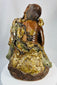 Chinese Buddhist folklore figure Jigong with gourd vessels and flowing vine leaves.