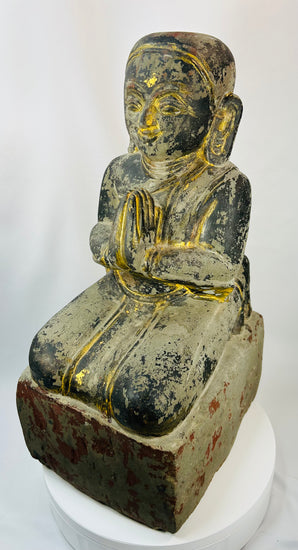 Mandalay period Burmese carved wooden devotee figure with traces of lacquer and gilding.