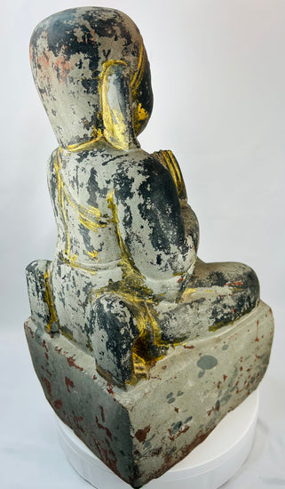 Burmese carved wooden temple attendant figure kneeling in reverence before Buddha.