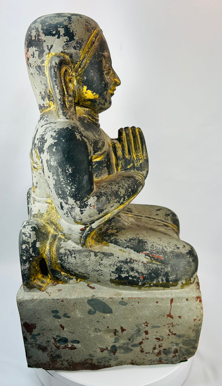 Mandalay period Myanmar devotional wood sculpture with folded legs and prayer hands.