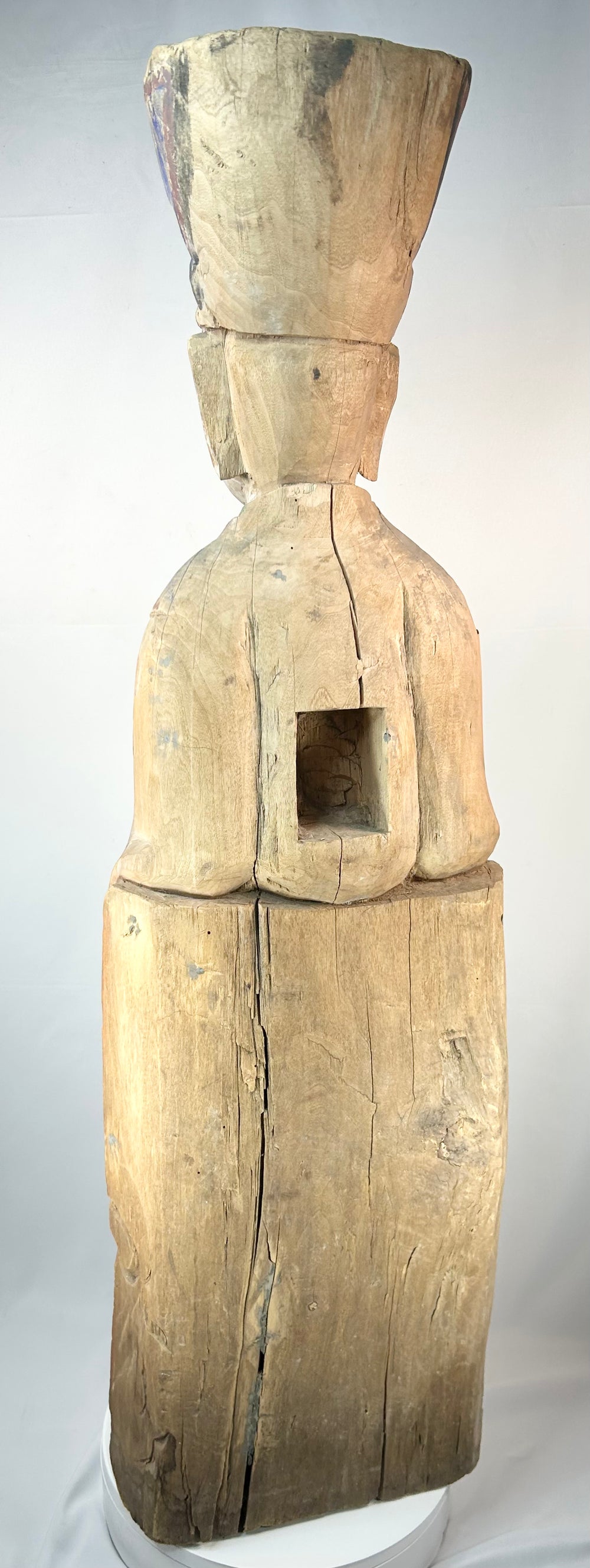 Antique Chinese shrine figure depicting a seated magistrate holding a ceremonial tablet.