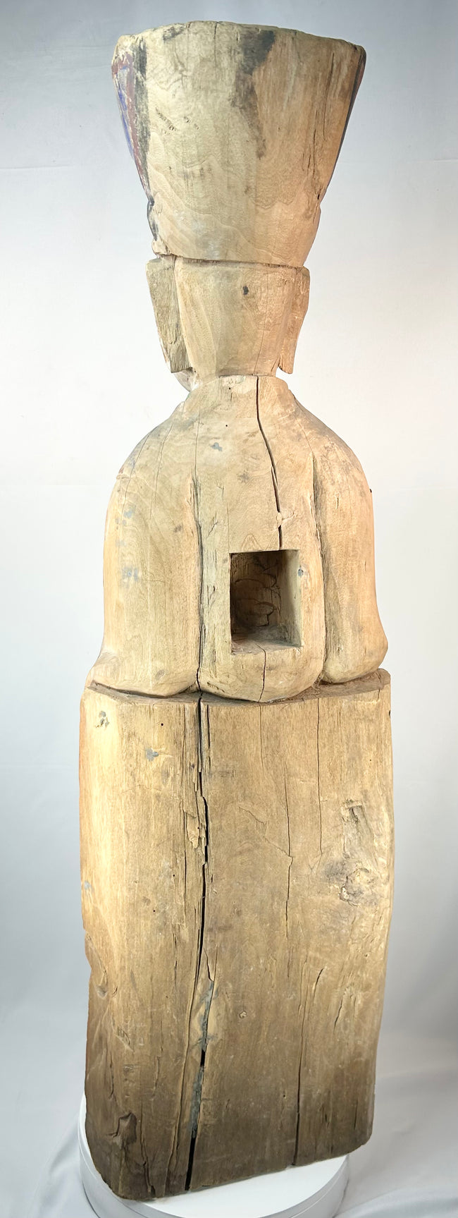 Antique Chinese shrine figure depicting a seated magistrate holding a ceremonial tablet.
