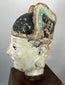 Antique Chinese terracotta official figure with elongated ears and painted features.
