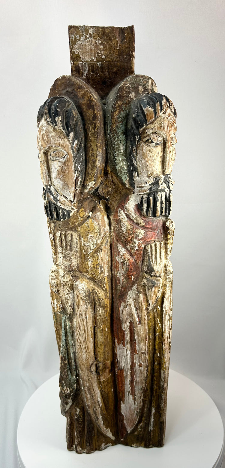 Hand-carved wooden column sculpture featuring four saintly figures in Spanish Colonial style.