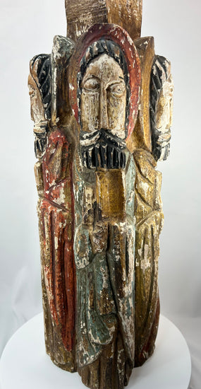Antique Spanish Colonial devotional sculpture with four carved saints arranged around a column.