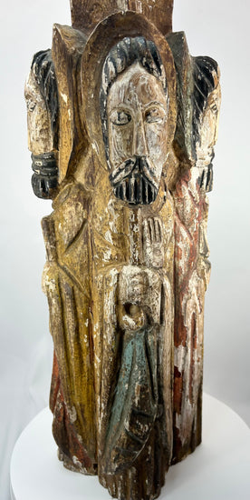 Antique Spanish Colonial religious sculpture with four standing saints and traces of pigment.
