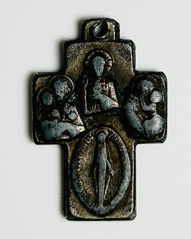 antique bronze cruciform devotional pendant featuring Virgin Mary and Christ Child relief imagery, 1800s religious cross found near maritime shipwreck site