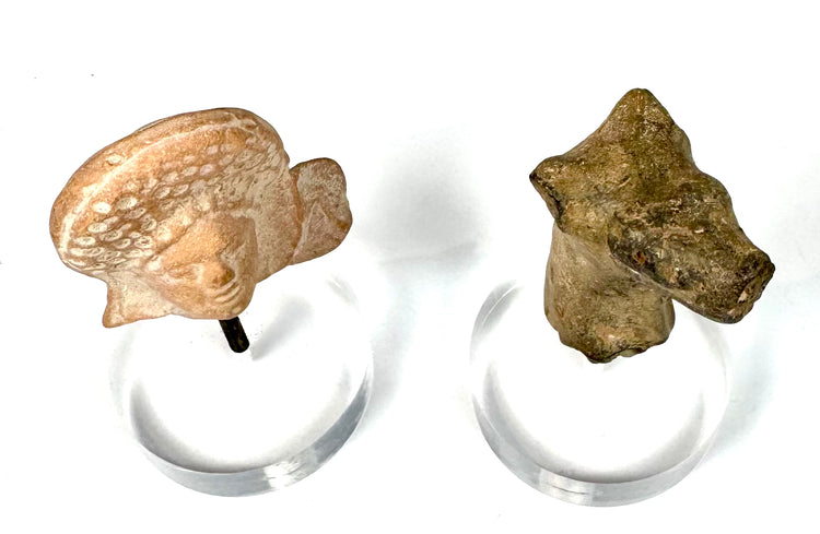 Collection of two ancient terracotta sculptures featuring a Roman Imperial female portrait fragment and Early Bronze Age Mesopotamian animal head.