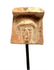 Archaic Greek terracotta female head fragment displaying a broad veil-like covering, softened facial modelling, and natural surface encrustations.