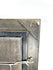 Reverse of a vintage European oil painting showing wooden backing, hanging hardware, and an original Littleton Auctions identification label.