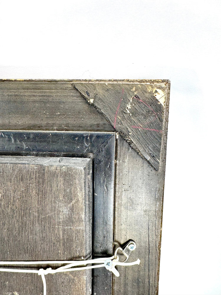 Reverse of a vintage European oil painting showing wooden backing, hanging hardware, and an original Littleton Auctions identification label.