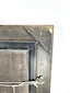 Reverse of a vintage European oil painting showing wooden backing, hanging hardware, and an original Littleton Auctions identification label.