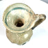 Late Roman blown glass jug with a trumpet-shaped opening, curved shoulder-to-rim handle, and surviving ancient decorative glasswork.