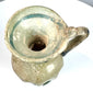 Late Roman blown glass jug with a trumpet-shaped opening, curved shoulder-to-rim handle, and surviving ancient decorative glasswork.