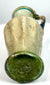 Ancient Roman–Byzantine glass jug, circa 4th–5th century CE, featuring pale green glass, extensive archaeological patination, and historical 1969 provenance.