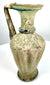 Roman–Byzantine glass vessel featuring a rounded, slightly flared base, elegant ovoid body, and weathered glass surfaces.