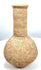 Roman stone unguentarium attributed to the 1st–3rd century CE, featuring a globular body, cylindrical neck, thick rim, and archaeological surface deposits.