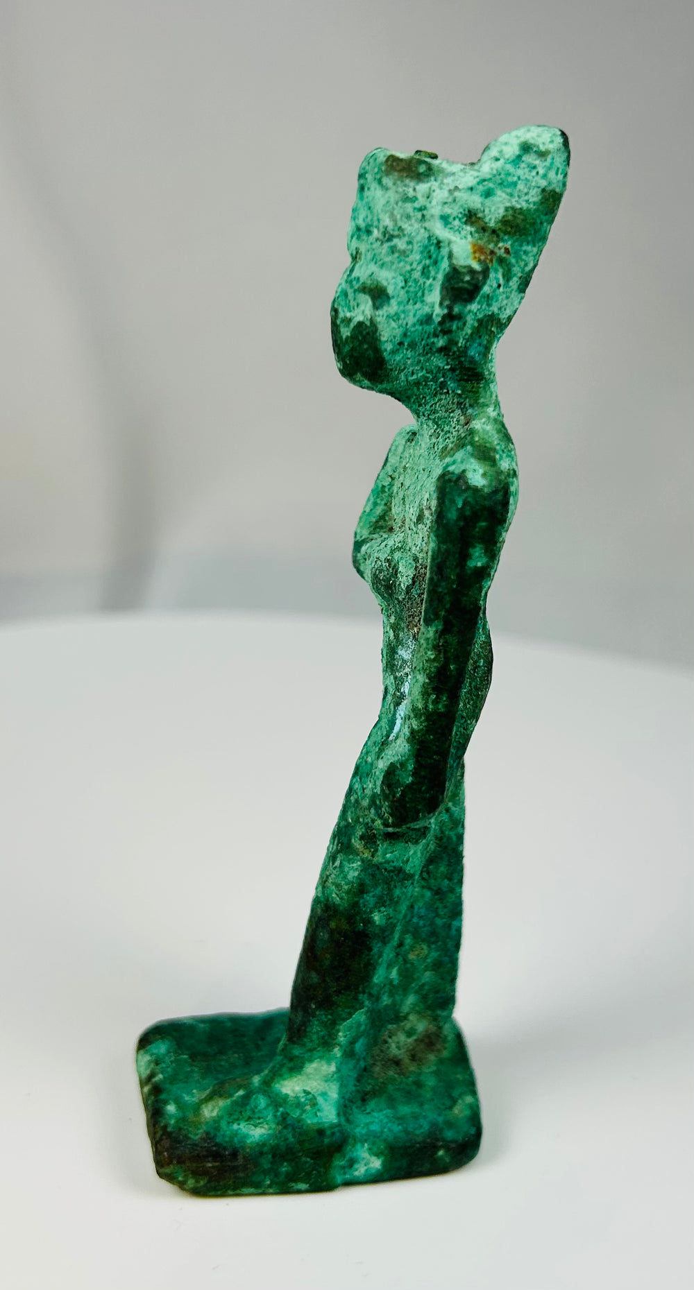 Authentic Egyptian bronze votive statue representing a female deity from the Late Period to Ptolemaic period.