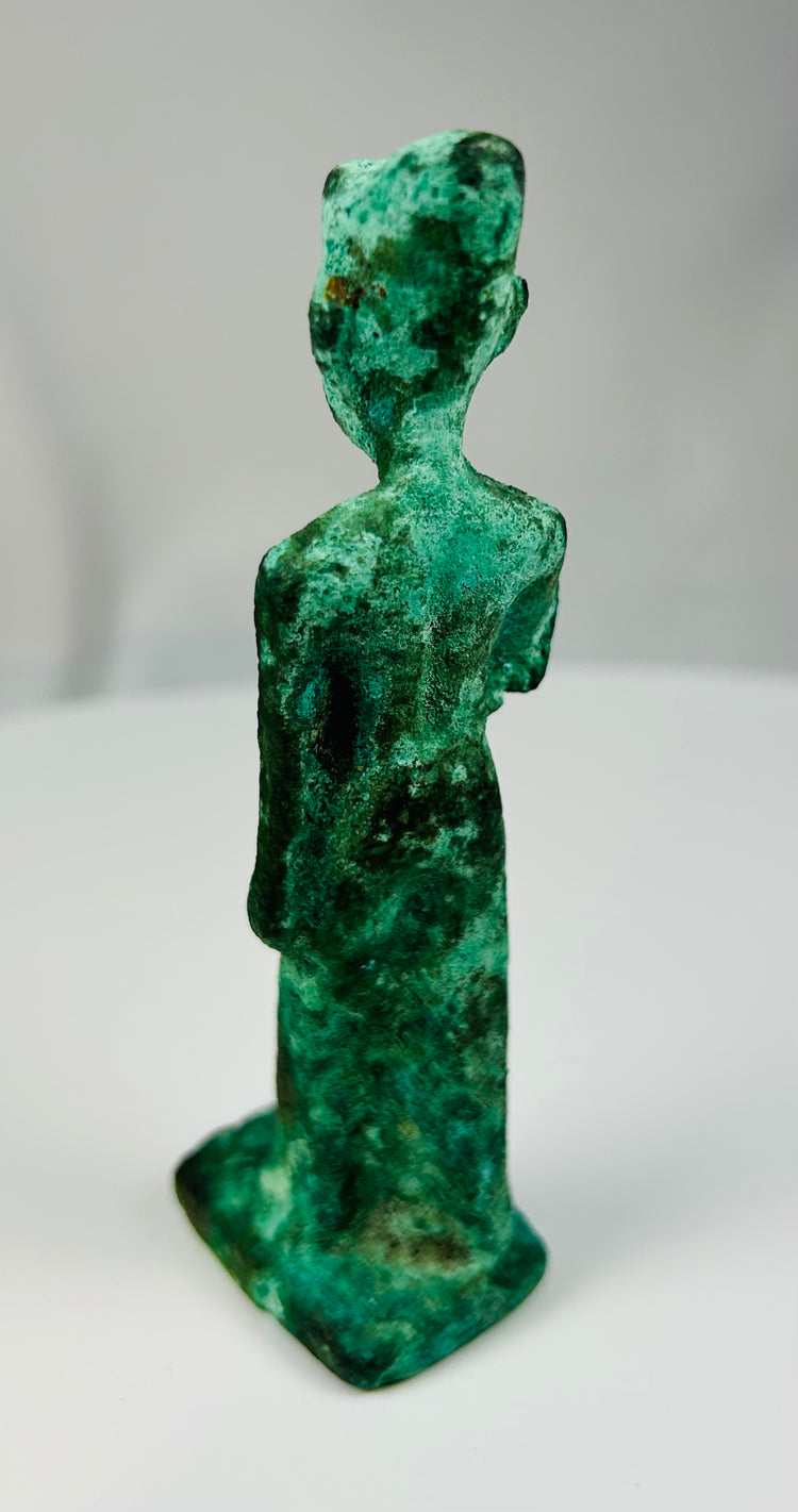 Late Period Egyptian bronze devotional statuette of a standing female deity.