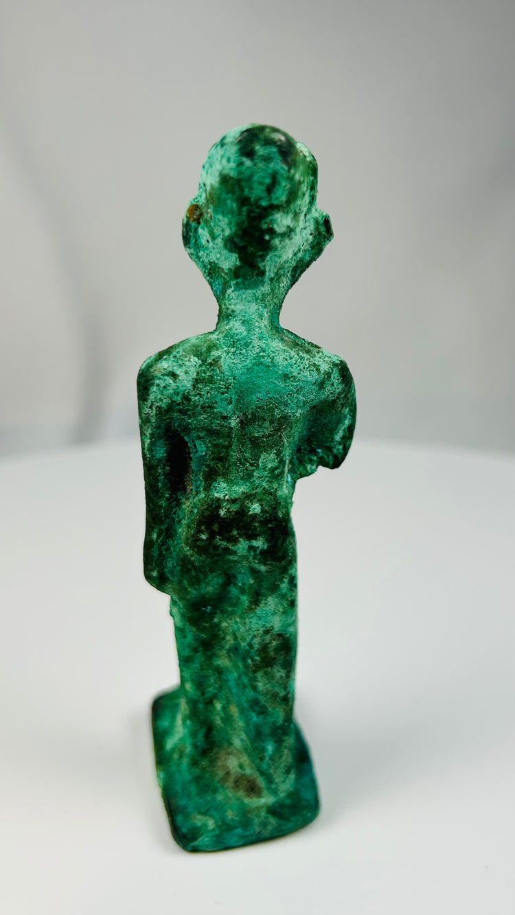 Ancient Egyptian bronze religious figure likely depicting the goddess Neith with integral base.